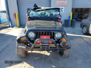 2004 Jeep Wrangler Rubicon with VIN 1J4FA69S74P785297, listed as a Copart auction lot 47332944 with 61,323 mi miles and Salvage Title. Bid and sale history available at carsss.com. Image 5.