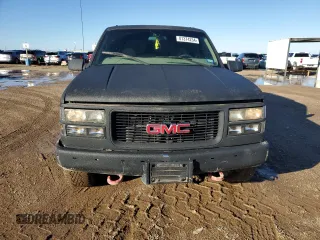 1997 GMC Yukon with VIN 1GKEK13R0VJ710179, listed as a Copart auction lot 81374234 with 186,257 mi miles and Salvage Title. Bid and sale history available at carsss.com. Image 5.