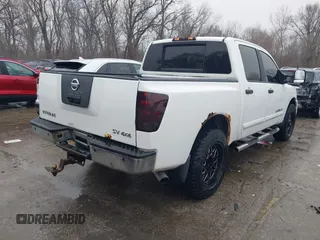 2011 Nissan Titan SL with VIN 1N6AA0EC8BN317497, listed as a IAAI auction lot 41443597 with 202,622 mi miles. Bid and sale history available at carsss.com. Image 4.