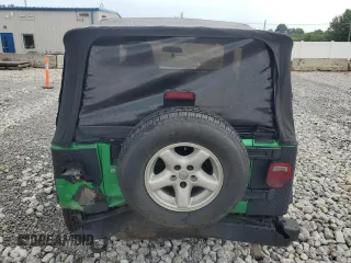 2004 Jeep Wrangler SE with VIN 1J4FA29124P769475, listed as a Copart auction lot 64371244 with 136,877 mi miles and Salvage title. Bid and sale history available at DreamBid. Image 6.