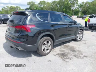 2021 Hyundai Santa Fe SE z VIN 5NMS14AJ0MH332918, wystawiony jako IAAI lot #42365534 z przebiegiem 58 720 mil mil oraz . Historia ofert i sprzedaży dostępna na DreamBid. Obrazek 4.
