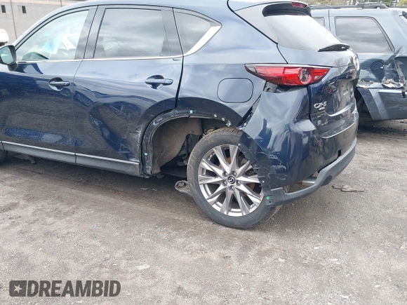 2020 Mazda CX-5 Grand Touring with VIN JM3KFBDM7L1723852, listed as a IAAI auction lot 41848152 with 85,099 mi miles. Bid and sale history available at carsss.com. Image 6.