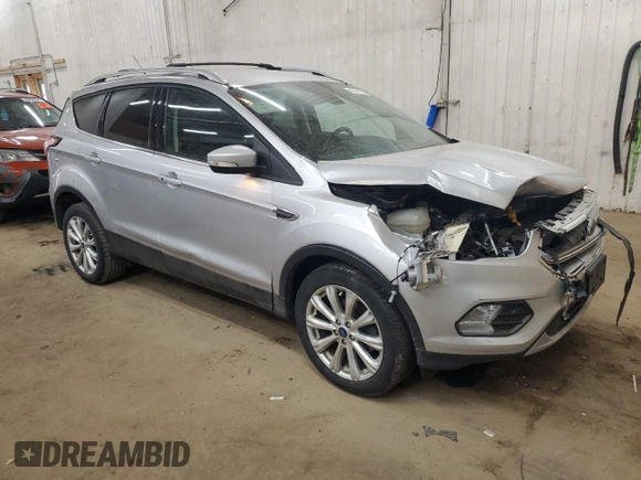 2017 Ford Escape Titanium with VIN 1FMCU0JD6HUE70200, listed as a Copart auction lot 49141595 with 92,159 mi miles and Salvage Title. Bid and sale history available at DreamBid. Image 4.