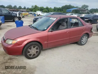 2002 Mazda Protege DX z VIN JM1BJ225521564900, wystawiony jako Copart lot #56835065 z przebiegiem 153 183 mil mil oraz Szkoda całkowita • Salvage title. Historia ofert i sprzedaży dostępna na DreamBid. Obrazek 1.