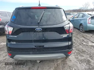 2018 Ford Escape Titanium with VIN 1FMCU0J90JUD17085, listed as a IAAI auction lot 41699687 with Not provided miles and . Bid and sale history available at DreamBid. Image 16.