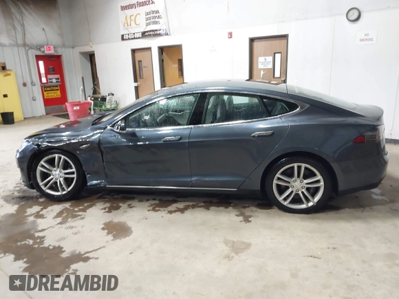 2014 Tesla Model S 60 with VIN 5YJSA1H16EFP52853, listed as a IAAI auction lot 41941989 with 132,038 mi miles and . Bid and sale history available at DreamBid. Image 14.
