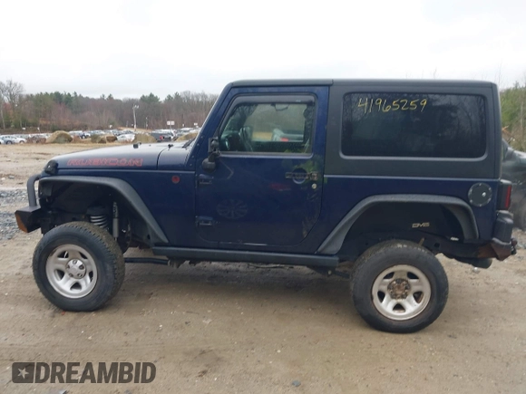 2013 Jeep Wrangler Rubicon 10th Anniversary with VIN 1C4BJWCG7DL544145, listed as a IAAI auction lot 41965259 with 125,900 mi miles and . Bid and sale history available at carsss.com. Image 15.