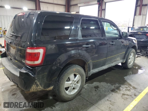 2011 Ford Escape XLS z VIN 1FMCU9C77BKC43662, wystawiony jako Copart lot #51779335 z przebiegiem 104 548 mil mil oraz Szkoda całkowita • Salvage title. Historia ofert i sprzedaży dostępna na DreamBid. Obrazek 3.