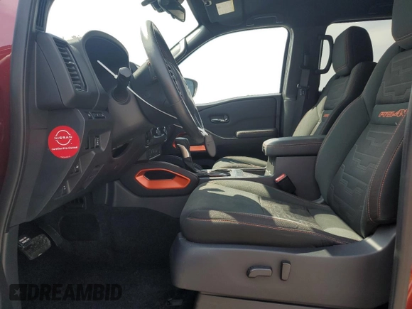 2022 Nissan Frontier Pro-4X with VIN 1N6ED1EK1NN601886, listed as a Copart auction lot 65182295 with 51,879 mi miles and Salvage title. Bid and sale history available at DreamBid. Image 7.