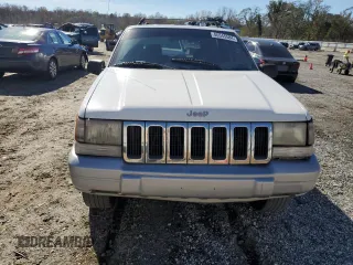 1996 Jeep Grand Cherokee Laredo with VIN 1J4FX58SXTC349575, listed as a Copart auction lot 80545584 with 302,636 mi miles and Salvage Title. Bid and sale history available at carsss.com. Image 5.