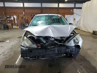 2003 Ford Focus SE z VIN 1FAFP34P43W186633, wystawiony jako Copart lot #56899065 z przebiegiem Nie podano mil oraz Szkoda całkowita • Salvage title. Historia ofert i sprzedaży dostępna na DreamBid. Obrazek 5.