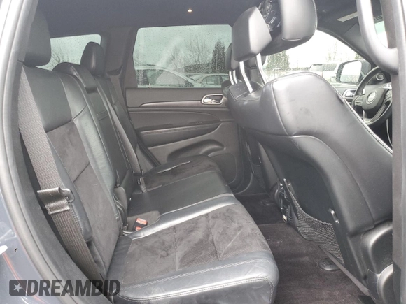 2018 Jeep Grand Cherokee Altitude with VIN 1C4RJFAG5JC219944, listed as a Copart auction lot 52030365 with 99,463 mi miles and Salvage title. Bid and sale history available at DreamBid. Image 12.