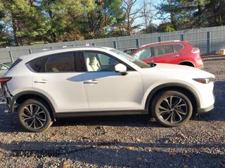 2023 Mazda CX-5 2.5 S Premium Plus Package with VIN JM3KFBEM2P0244281, listed as a IAAI auction lot 40820295 with 10,886 mi miles. Bid and sale history available at carsss.com. Image 13.