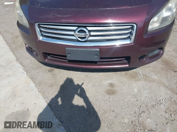 2014 Nissan Maxima S with VIN 1N4AA5AP1EC435440, listed as a IAAI auction lot 42090636 with 199,110 mi miles and . Bid and sale history available at DreamBid. Image 6.
