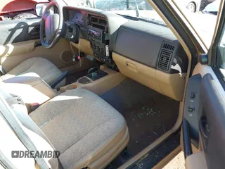 1999 Jeep Cherokee Sport with VIN 1J4FT68S7XL589206, listed as a IAAI auction lot 41411949 with 143,158 mi miles and . Bid and sale history available at DreamBid. Image 5.