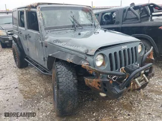 2015 Jeep Wrangler Unlimited Willys Wheeler with VIN 1C4BJWDG3FL592128, listed as a IAAI auction lot 41174459 with 161,577 mi miles. Bid and sale history available at carsss.com. Image 1.