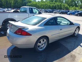 2002 Mercury Cougar z VIN 1ZWHT61L525621044, wystawiony jako IAAI lot #42300332 z przebiegiem 70 134 mil mil oraz . Historia ofert i sprzedaży dostępna na DreamBid. Obrazek 4.