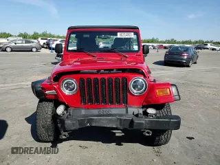 2003 Jeep Wrangler Sport z VIN 1J4FA49S33P302780, wystawiony jako Copart lot #60354805 z przebiegiem 201 679 mil mil oraz Szkoda całkowita • Salvage title. Historia ofert i sprzedaży dostępna na DreamBid. Obrazek 13.