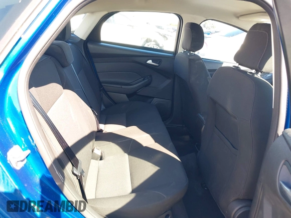 2018 Ford Focus SE z VIN 1FADP3FE4JL279265, wystawiony jako IAAI lot #42068130 z przebiegiem 43 616 mil mil oraz . Historia ofert i sprzedaży dostępna na DreamBid. Obrazek 8.