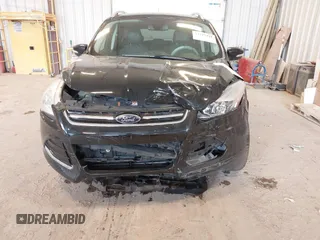 2016 Ford Escape Titanium with VIN 1FMCU0JX3GUB70607, listed as a IAAI auction lot 41727421 with 106,857 mi miles. Bid and sale history available at carsss.com. Image 6.