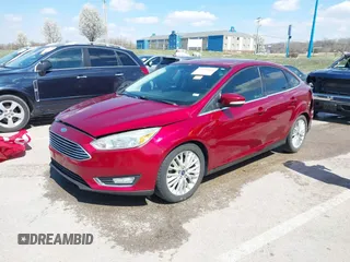 2015 Ford Focus Titanium with VIN 1FADP3J29FL230664, listed as a IAAI auction lot 41870083 with 125,578 mi miles and . Bid and sale history available at DreamBid. Image 2.