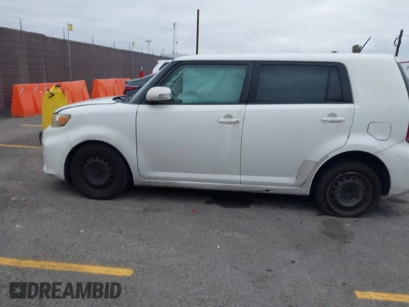 2014 Scion xB with VIN JTLZE4FEXEJ054060, listed as a IAAI auction lot 42096159 with 211,994 mi miles. Bid and sale history available at carsss.com. Image 14.