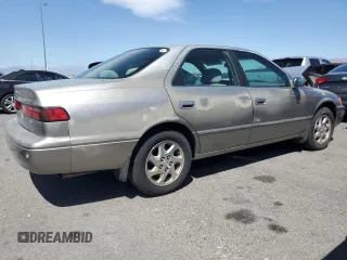1999 Toyota Camry LE z VIN JT2BF22K4X0202019, wystawiony jako Copart lot #56104335 z przebiegiem 192 643 mil mil oraz Tytuł czysty. Historia ofert i sprzedaży dostępna na DreamBid. Obrazek 3.