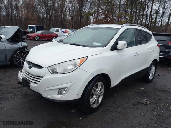 2013 Hyundai Tucson GLS with VIN KM8JU3AC1DU713695, listed as a IAAI auction lot 41461134 with 118,789 mi miles. Bid and sale history available at carsss.com. Image 16.