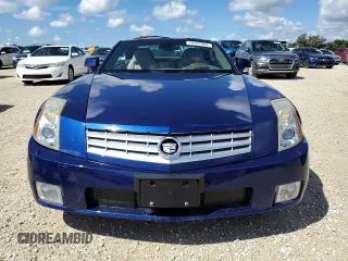 2004 Cadillac XLR z VIN 1G6YV34A045601459, wystawiony jako Copart lot #74522994 z przebiegiem Nie podano mil oraz Szkody całkowita. Historia ofert i sprzedaży dostępna na DreamBid. Obrazek 5.