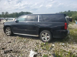2015 Chevrolet Suburban LTZ with VIN 1GNSKKKC8FR199218, listed as a Copart auction lot 64147184 with 181,676 mi miles and Salvage Title. Bid and sale history available at DreamBid. Image 2.