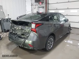 2021 Toyota Prius L Eco with VIN JTDKAMFU9M3132587, listed as a IAAI auction lot 41637275 with 84,203 mi miles. Bid and sale history available at carsss.com. Image 4.