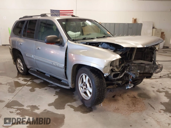 2003 GMC Envoy SLT z VIN 1GKDS13S932299354, wystawiony jako IAAI lot #41238557 z przebiegiem 251 535 mil mil oraz . Historia ofert i sprzedaży dostępna na DreamBid. Obrazek 1.