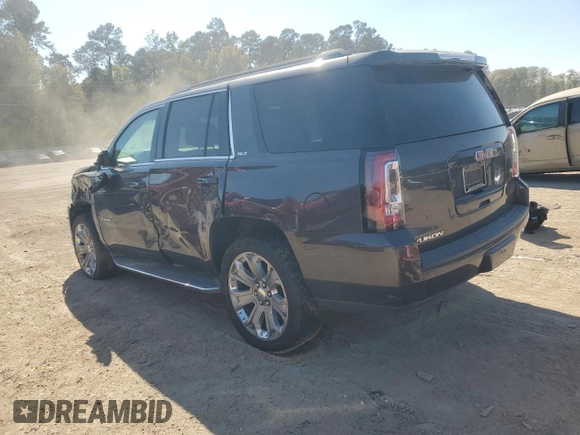 2015 GMC Yukon SLT with VIN 1GKS1BKC0FR239629, listed as a Copart auction lot 77414814 with 171,611 mi miles and Salvage Title. Bid and sale history available at carsss.com. Image 2.