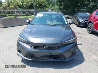 2023 Honda Civic EX with VIN 2HGFE1F75PH302414, listed as a IAAI auction lot 42680807 with 49,520 mi miles and . Bid and sale history available at DreamBid. Image 12.