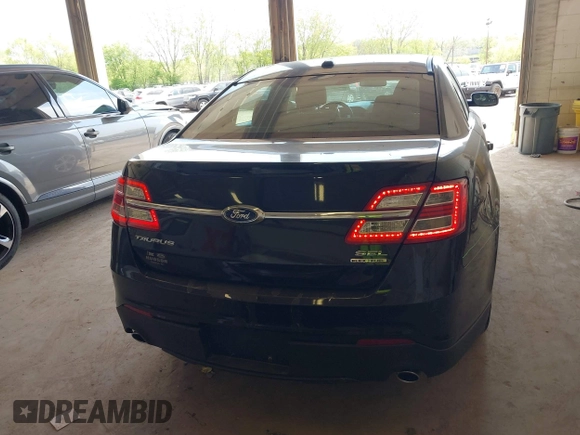 2015 Ford Taurus SEL with VIN 1FAHP2E84FG190092, listed as a IAAI auction lot 42215979 with 187,871 mi miles and . Bid and sale history available at DreamBid. Image 16.