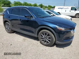 2018 Mazda CX-5 Grand Touring с VIN JM3KFBDM8J0344328, выставлен на аукционе Copart как лот 57665175 с пробегом 131 175 миль миль и Списание • Salvage title. История ставок и продаж доступна на DreamBid. Изображение 4.