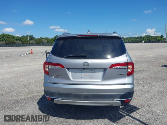 2021 Honda Pilot Touring 8-Passenger with VIN 5FNYF5H99MB041638, listed as a IAAI auction lot 42112915 with 33,230 mi miles and . Bid and sale history available at DreamBid. Image 16.