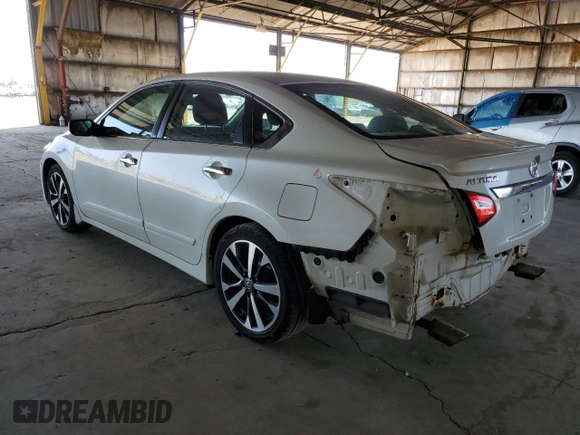2016 Nissan Altima SL with VIN 1N4AL3AP0GC272698, listed as a Copart auction lot 52001905 with 126,324 mi miles and Salvage title. Bid and sale history available at DreamBid. Image 2.