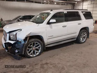 2015 GMC Yukon SLE with VIN 1GKS2AKC6FR103447, listed as a IAAI auction lot 41596220 with 104,209 mi miles. Bid and sale history available at carsss.com. Image 2.