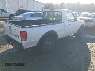 1999 Mazda B-Series 2WD Truck SX with VIN 4F4YR12C2XTM30361, listed as a IAAI auction lot 41439064 with 147,901 mi miles. Bid and sale history available at carsss.com. Image 4.