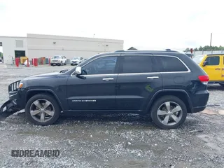 2015 Jeep Grand Cherokee Overland with VIN 1C4RJECG3FC152601, listed as a IAAI auction lot 42414340 with 139,315 mi miles and . Bid and sale history available at DreamBid. Image 14.