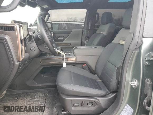 2024 GMC Hummer EV 3X z VIN 1GKB0RDC6RU101989, wystawiony jako Copart lot #85671314 z przebiegiem 7434 mil mil oraz Szkody całkowita. Historia ofert i sprzedaży dostępna na DreamBid. Obrazek 7.