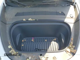 2022 Tesla Model Y Long Range z VIN 7SAYGDEE2NF513823, wystawiony jako Copart lot #51174795 z przebiegiem 28 143 mil mil oraz Szkody całkowita. Historia ofert i sprzedaży dostępna na DreamBid. Obrazek 12.