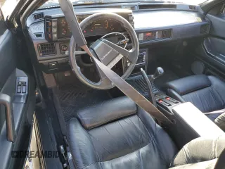 1987 Chrysler Conquest z VIN JJ3CC54N1HZ023316, wystawiony jako Copart lot #83362964 z przebiegiem 196 755 mil mil oraz Szkody całkowita. Historia ofert i sprzedaży dostępna na DreamBid. Obrazek 8.