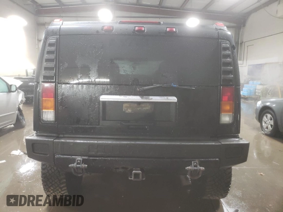 2003 Hummer H2 with VIN 5GRGN23U33H143023, listed as a Copart auction lot 84403414 with 0 mi miles and Salvage Title. Bid and sale history available at carsss.com. Image 6.