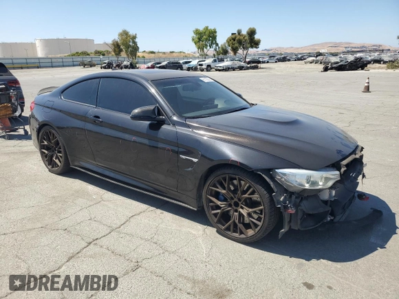 2015 BMW M4 with VIN WBS3R9C50FK333819, listed as a Copart auction lot 61105565 with 168,932 mi miles and Salvage title. Bid and sale history available at DreamBid. Image 4.