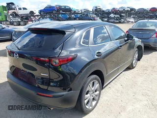 2021 Mazda CX-30 Select z VIN 3MVDMABL1MM251761, wystawiony jako IAAI lot #42267217 z przebiegiem 42 617 mil mil oraz . Historia ofert i sprzedaży dostępna na DreamBid. Obrazek 4.