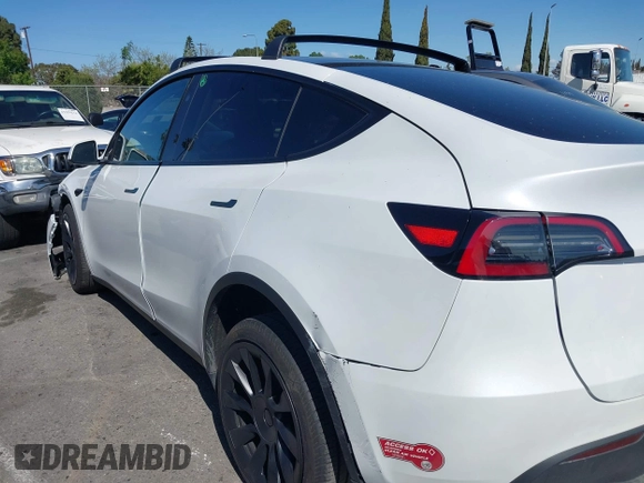 2023 Tesla Model Y Long Range with VIN 7SAYGDEEXPA152986, listed as a IAAI auction lot 41946665 with 13,574 mi miles and . Bid and sale history available at carsss.com. Image 14.