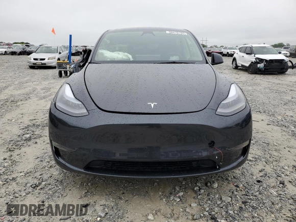 2024 Tesla Model Y Long Range with VIN 7SAYGAEE7RF005786, listed as a Copart auction lot 58415195 with 8,700 mi miles and Salvage title. Bid and sale history available at DreamBid. Image 5.