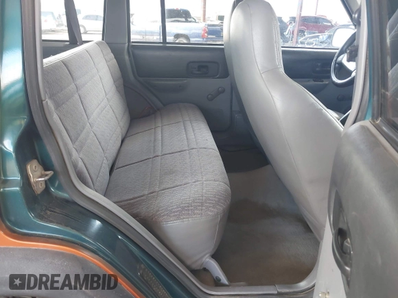 1997 Jeep Cherokee Sport with VIN 1J4FJ68SXVL517077, listed as a IAAI auction lot 42350553 with Not provided miles and . Bid and sale history available at DreamBid. Image 8.